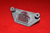 1988 - 1996 Corvette Rear License Plate Light  /  Product Number: LM172